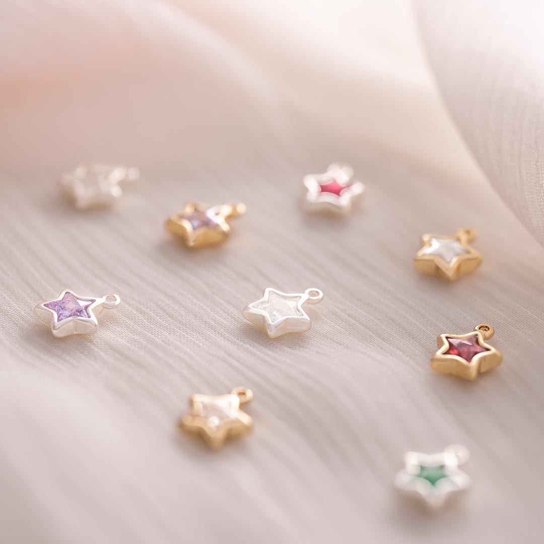 silver and champagne gold plated 4 mm star birthstone charm