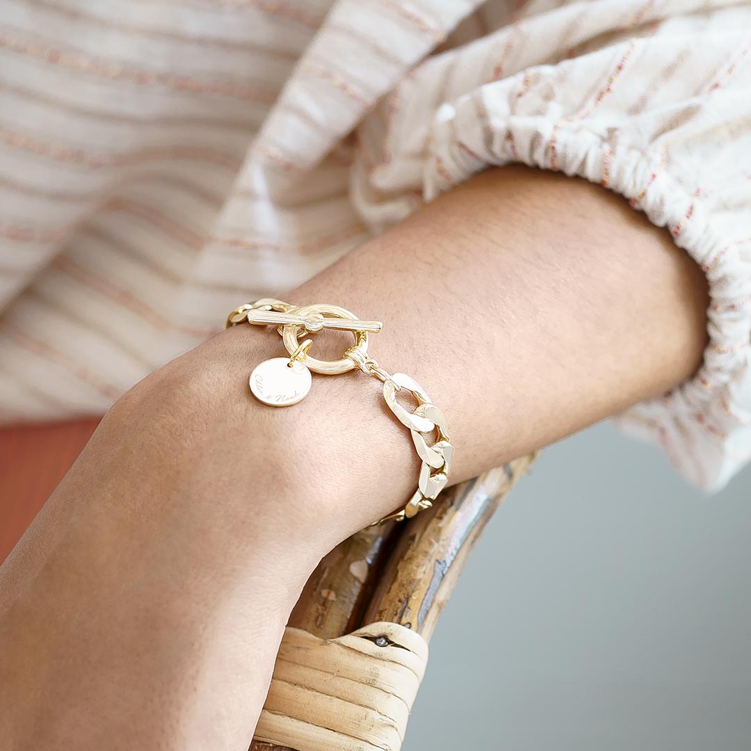 gold plated curb chain and disc statement bracelet