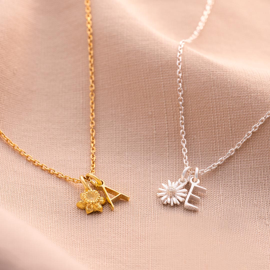 gold plated sterling silver and sterling silver necklace personalised with an attached initial charm and birth flower charm